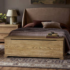 Four Hands Quintin Trunk in Worn Oak in a neutral bedroom at Addison West