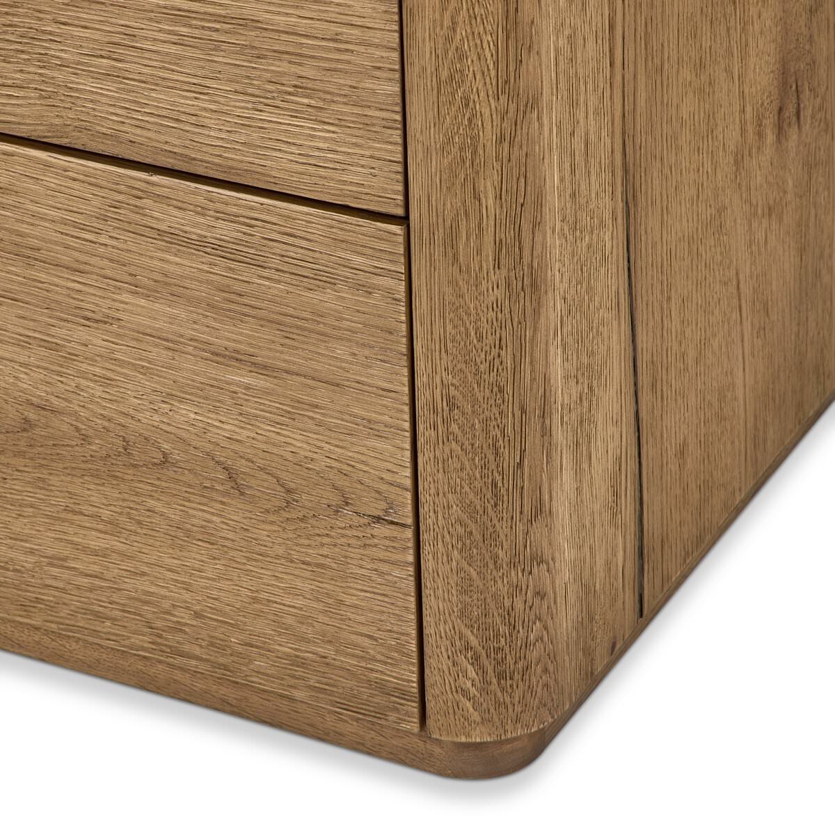 Close up of Four Hands Raleigh 6 Drawer Dresser in Worn Oak Veneer on a white background at Addison West