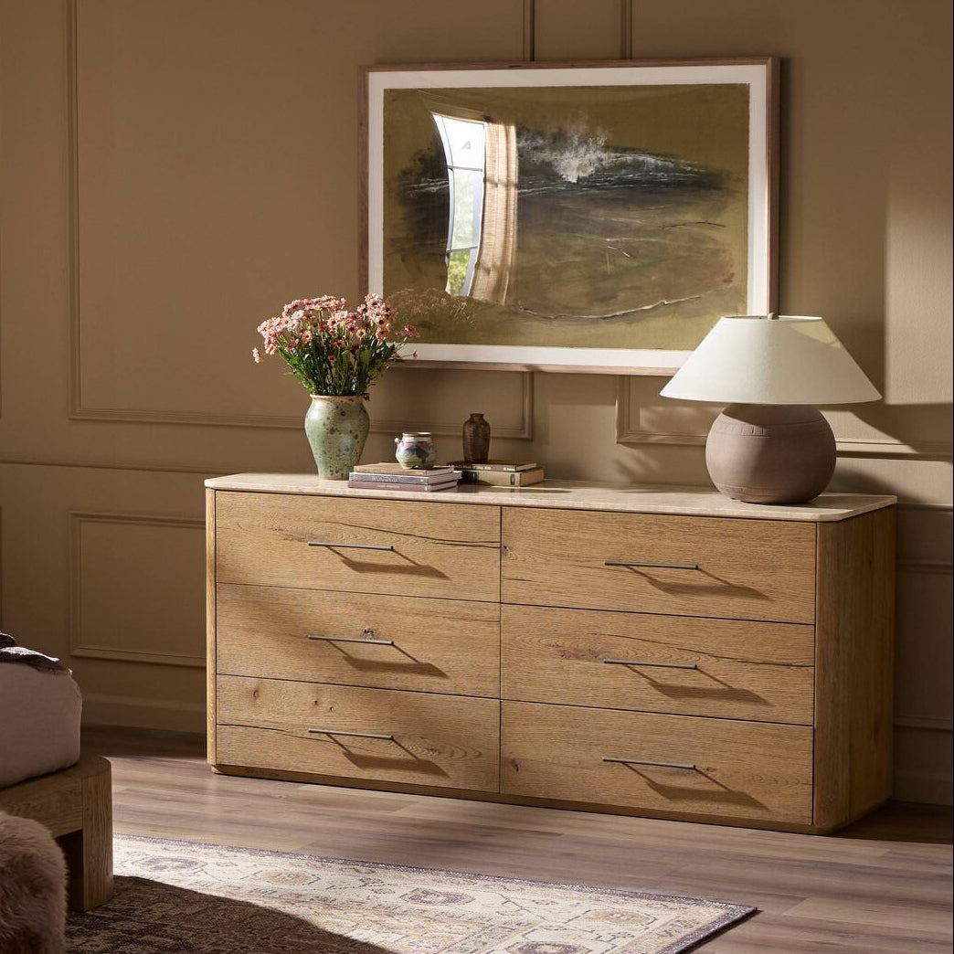 Four Hands Raleigh 6 Drawer Dresser in Worn Oak Veneer in a bedroom at Addison West