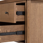 Close up of drawers of Four Hands Roark Nightstand on a white background