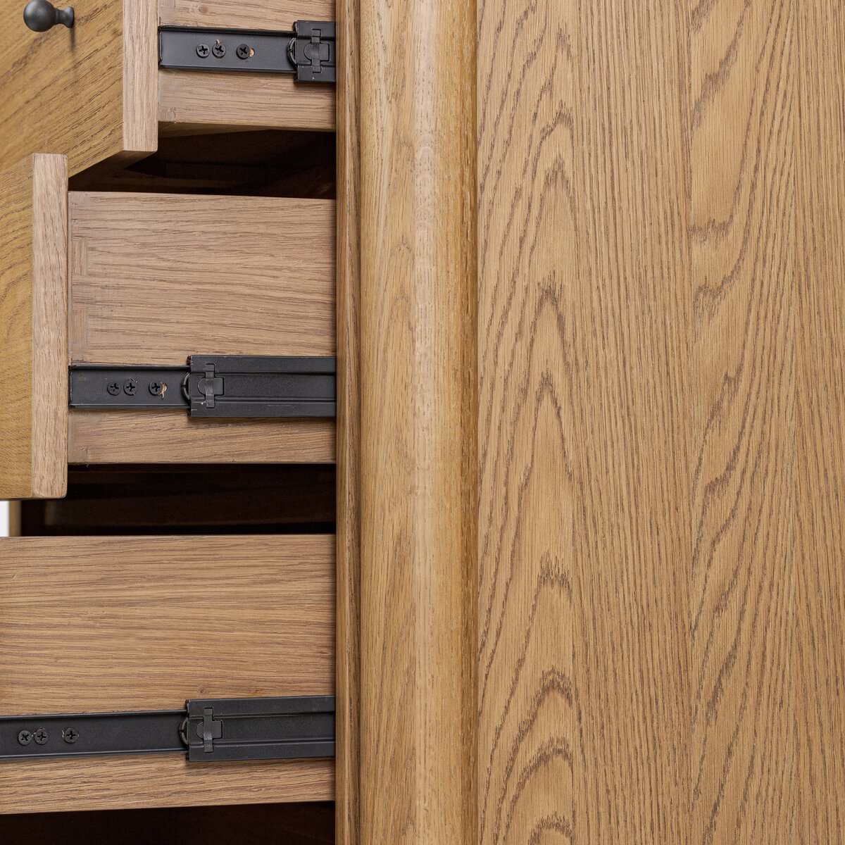 Close up of Four Hands Roark Tall Dresser in Amber Oak on a white background at Addison West