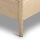 Close up of Four Hands Rosedale Bed in Knoll Natural on a white background