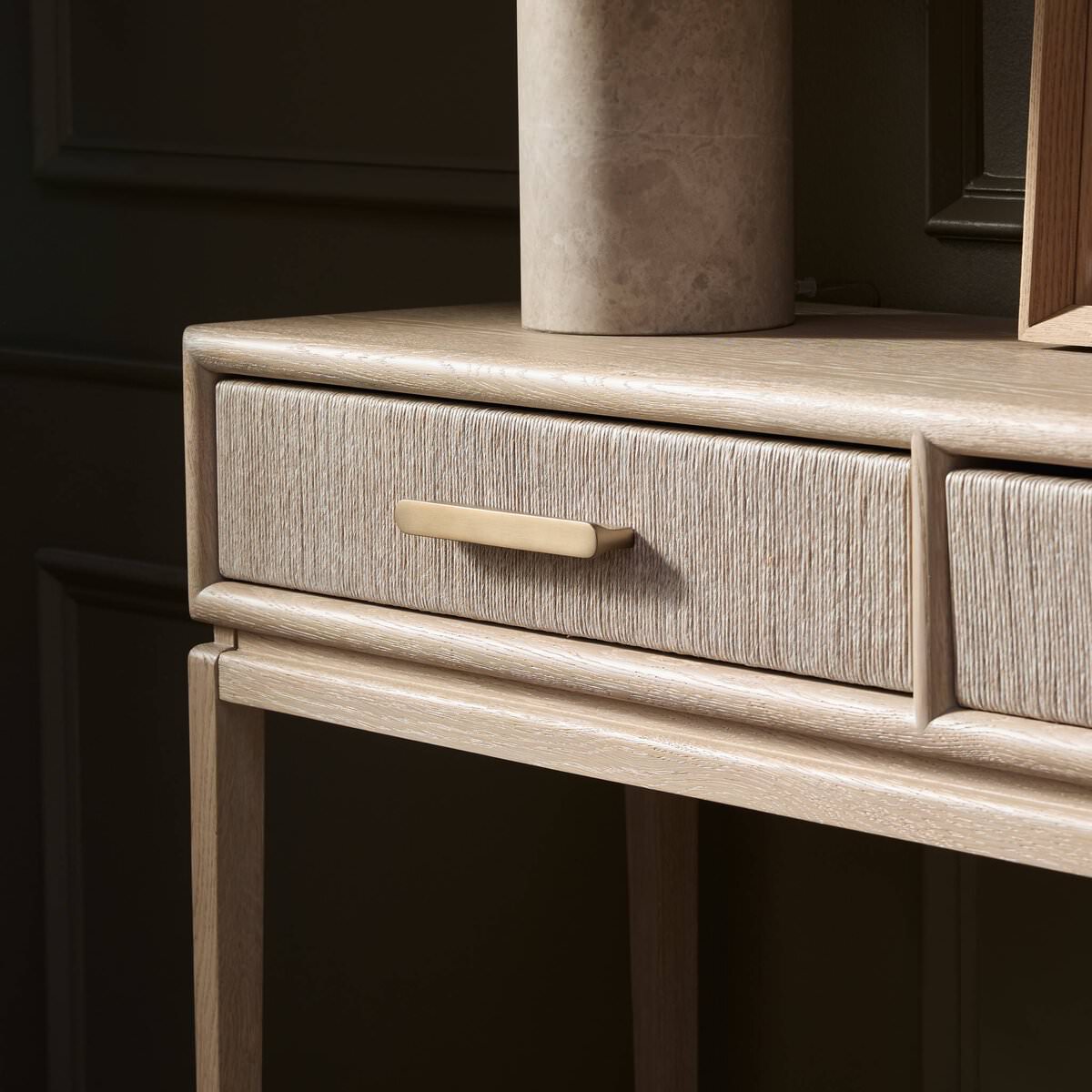 Close up of Four Hands Rosenell Console Table - 78" in Natural Oak Solid in a living room at Addison West
