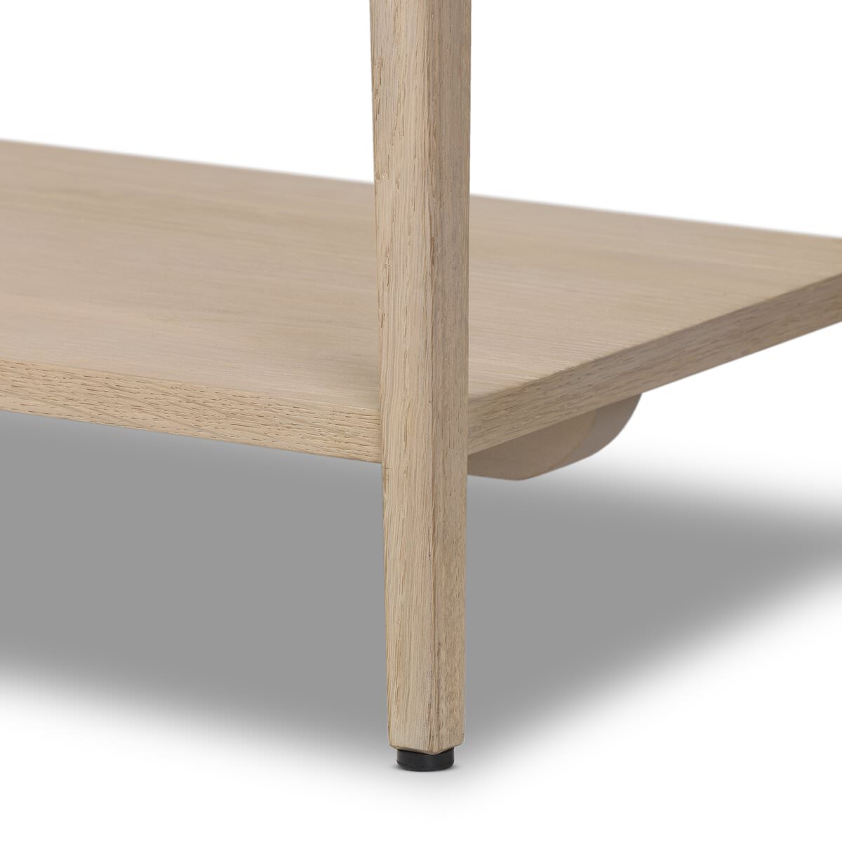 Close up of Four Hands Rosenell Console Table - 78" in Natural Oak Solid on a white background at Addison West