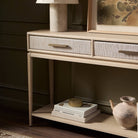 Close up of Four Hands Rosenell Console Table - 78" in Natural Oak Solid in a living room at Addison West