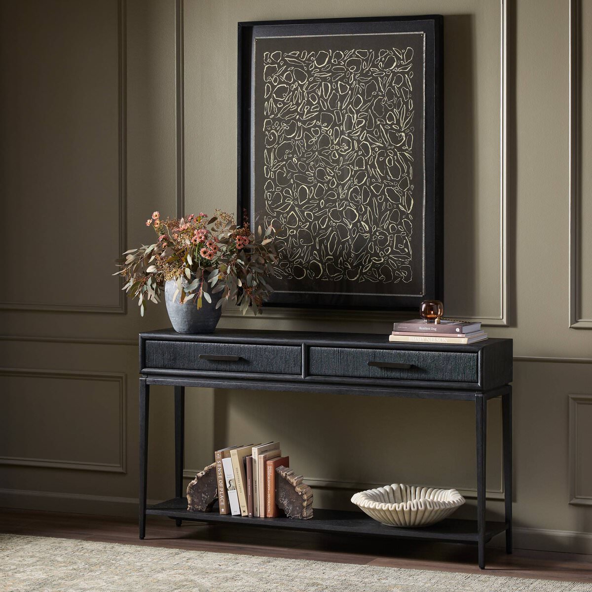 Four Hands Rosenell Console Table 60" in Black Oak Solid in a living room at Addison West
