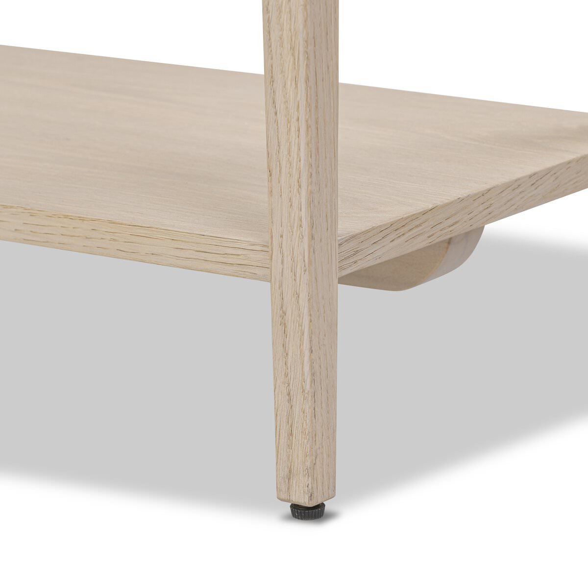 Close up of Four Hands Rosenell Console Table 60" in Natural Oak Solid on a white background at Addison West