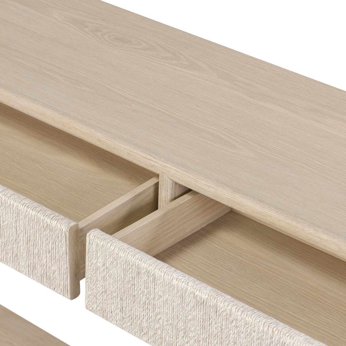 Close up of Four Hands Rosenell Console Table 60" in Natural Oak Solid on a white background at Addison West