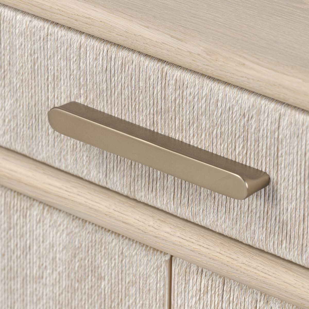 Close up of Four Hands Rosenell Sideboard in Natural Paper Cord on a white background at Addison West