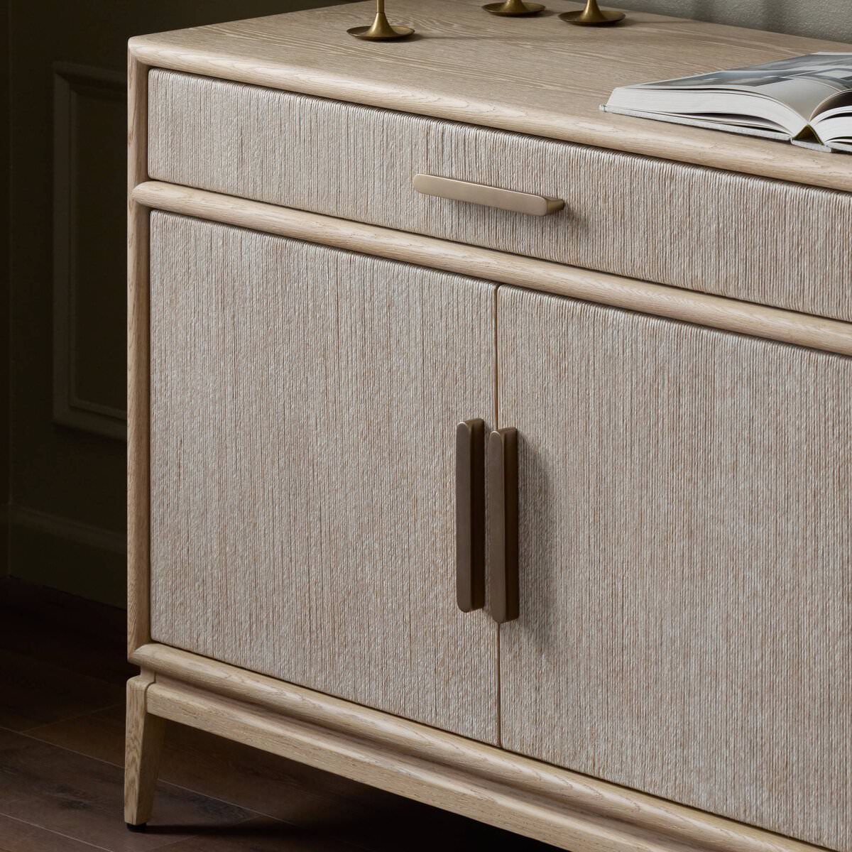 Close up of Four Hands Rosenell Sideboard in Natural Paper Cord in a living room at Addison West