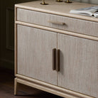 Close up of Four Hands Rosenell Sideboard in Natural Paper Cord in a living room at Addison West