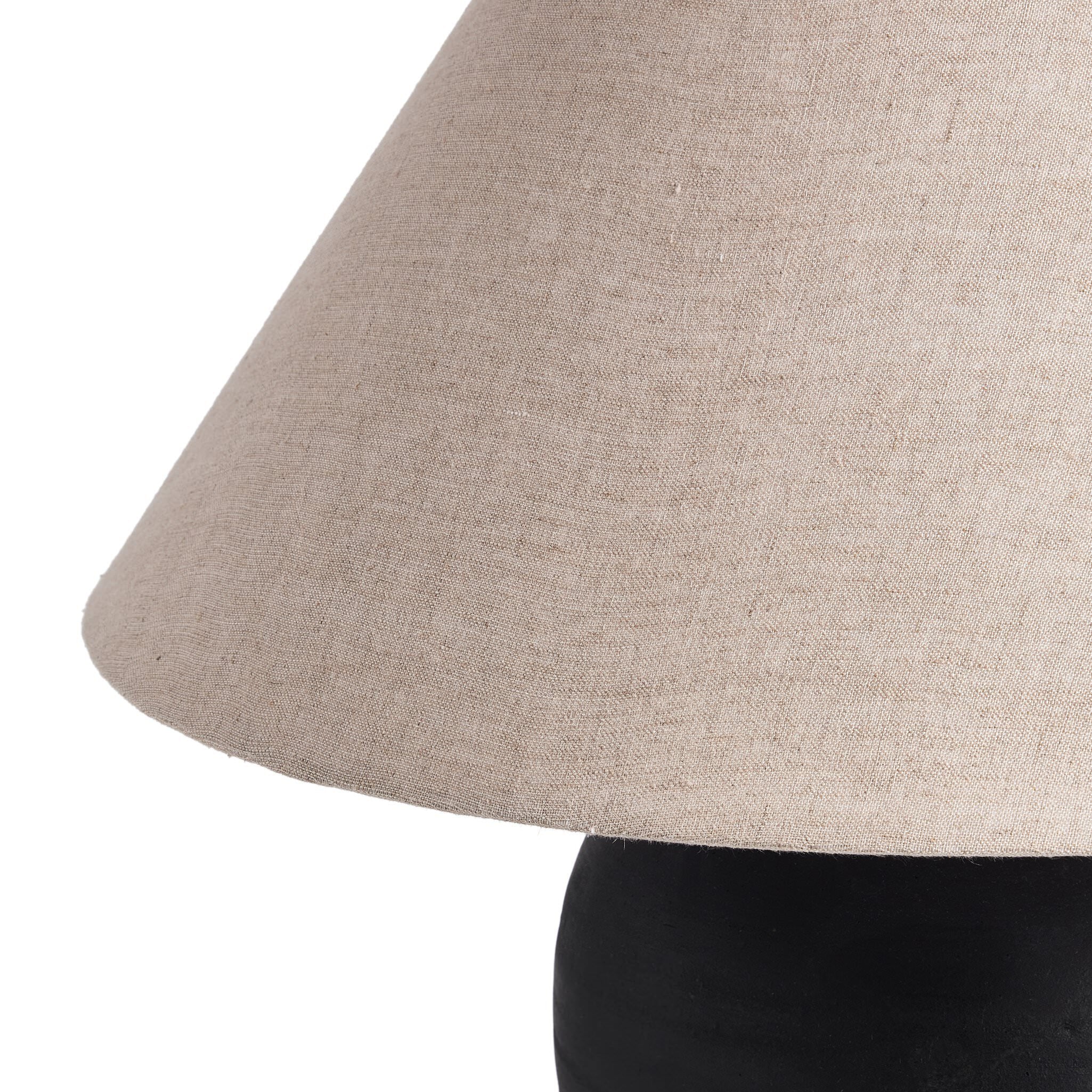 Close up of Four Hands Russo Table Lamp in Aged Black Terracotta on a white background at Addison West