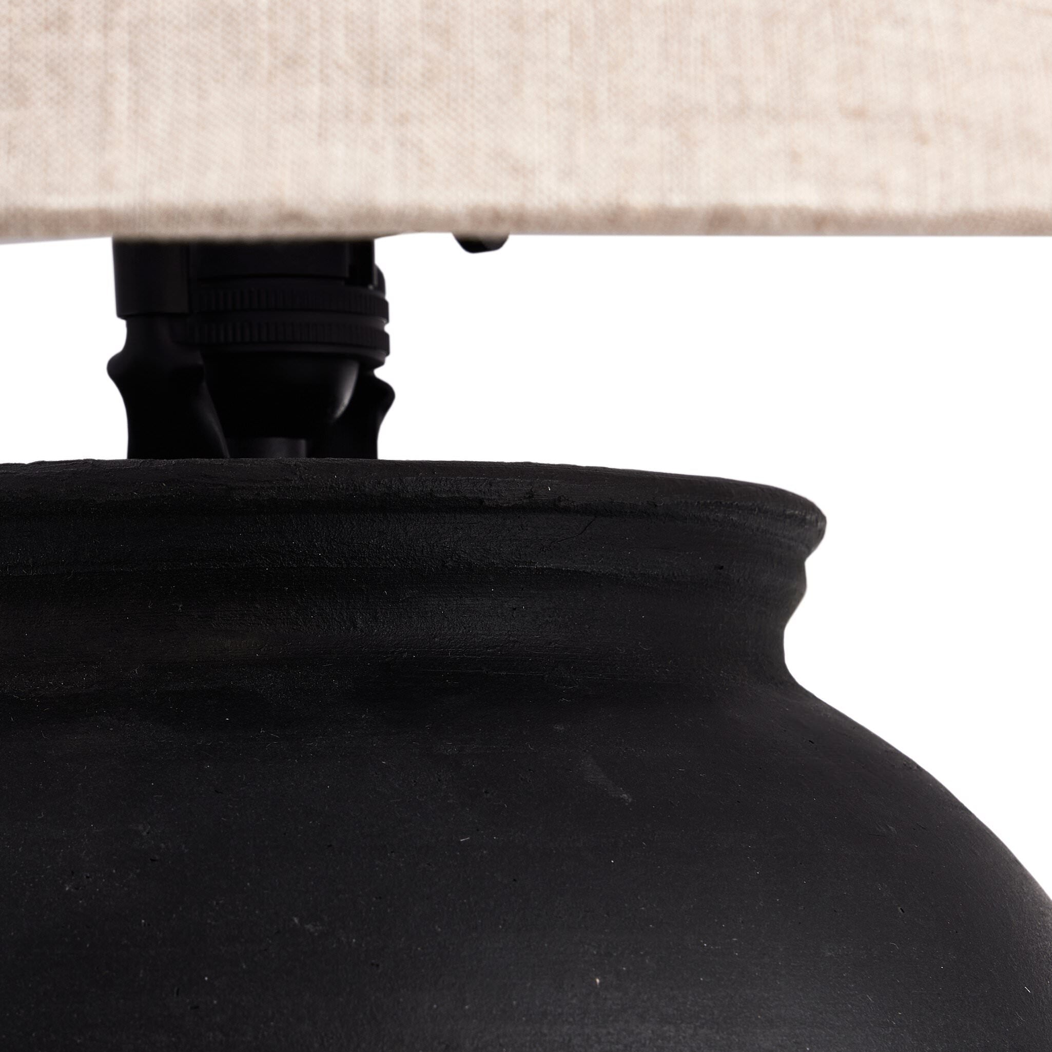 Close up of Four Hands Russo Table Lamp in Aged Black Terracotta on a white background at Addison West