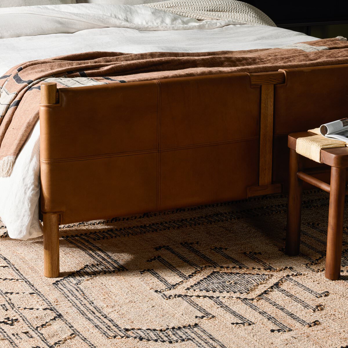 Close up of Four Hands Salado Bed in Heirloom Sienna, Queen in a bedroom at Addison West