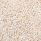 Close up of Four Hands Saldino Counter Stool in Beige Shearling on a white background at Addison West