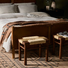 Four Hands Shona Stool in Vintage Cotton in a bedroom at the end of the bed