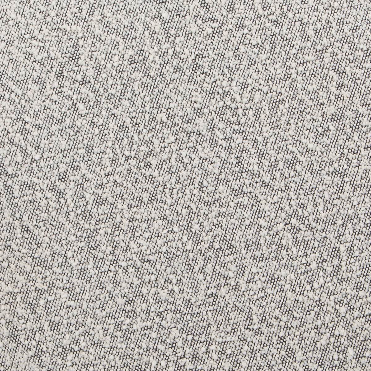 Close up of Four Hands Sinclair Round Ottoman in Knoll Domino on a white background