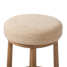 Close up of Four Hands Staria Swivel Counter Stool in Saxon Sand on a white background at Addison West