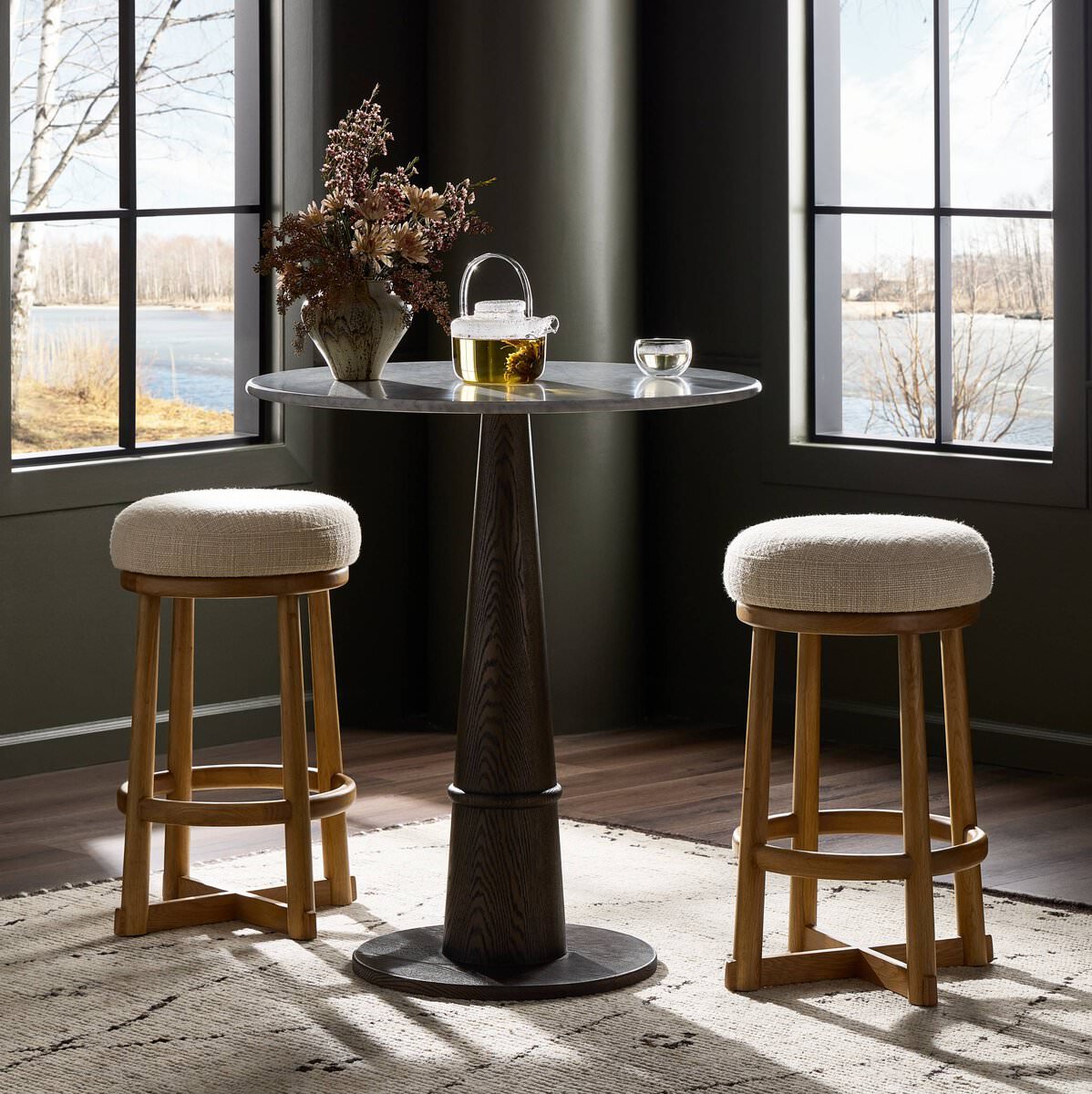 Four Hands Staria Swivel Counter Stool in Saxon Sand in a dining room at Addison West