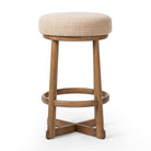 Four Hands Staria Swivel Counter Stool in Saxon Sand on a white background at Addison West