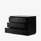 Black Suki nightstand with 3 drawers and brass hardware made by Four Hands Furniture on a white background
