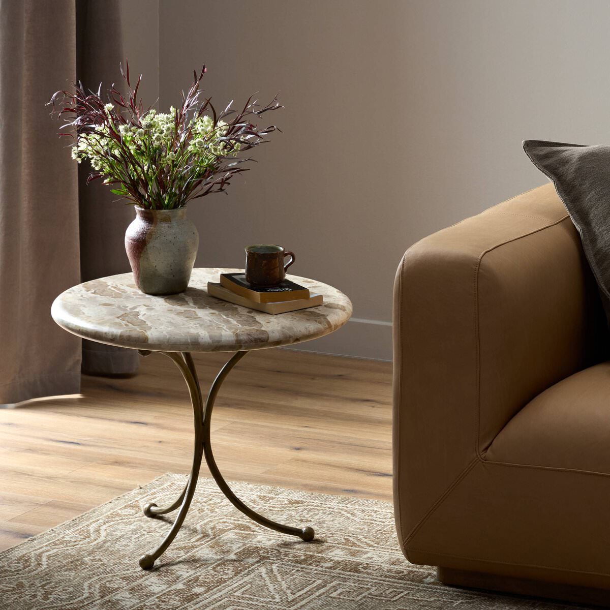 Four Hands Sylas End Table in Fossil Marble in a living room at Addison West