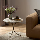 Four Hands Sylas End Table in Fossil Marble in a living room at Addison West