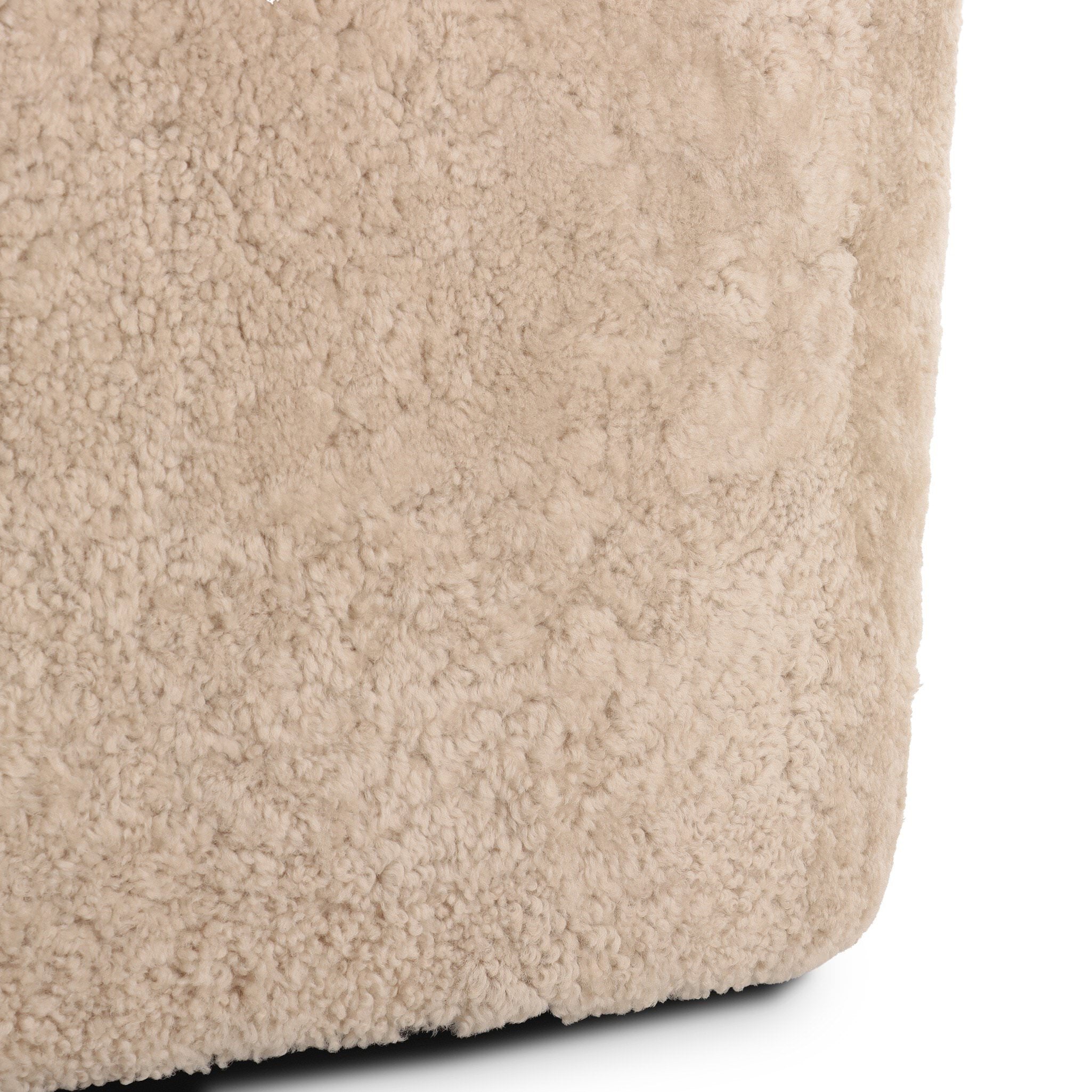 Close up of Four Hands Topanga Swivel Chair in Beige Shearling on a white background at Addison West