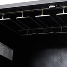 Close up of Four Hands Trey Bar Cabinet in Black Wash Poplar on a white background