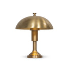 Four Hands Trieste Table Lamp in Raw Brass on a white background at Addison West