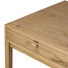 Close up of Four Hands Tula Writing Desk in Worn Oak Veneer on a white background at Addison West