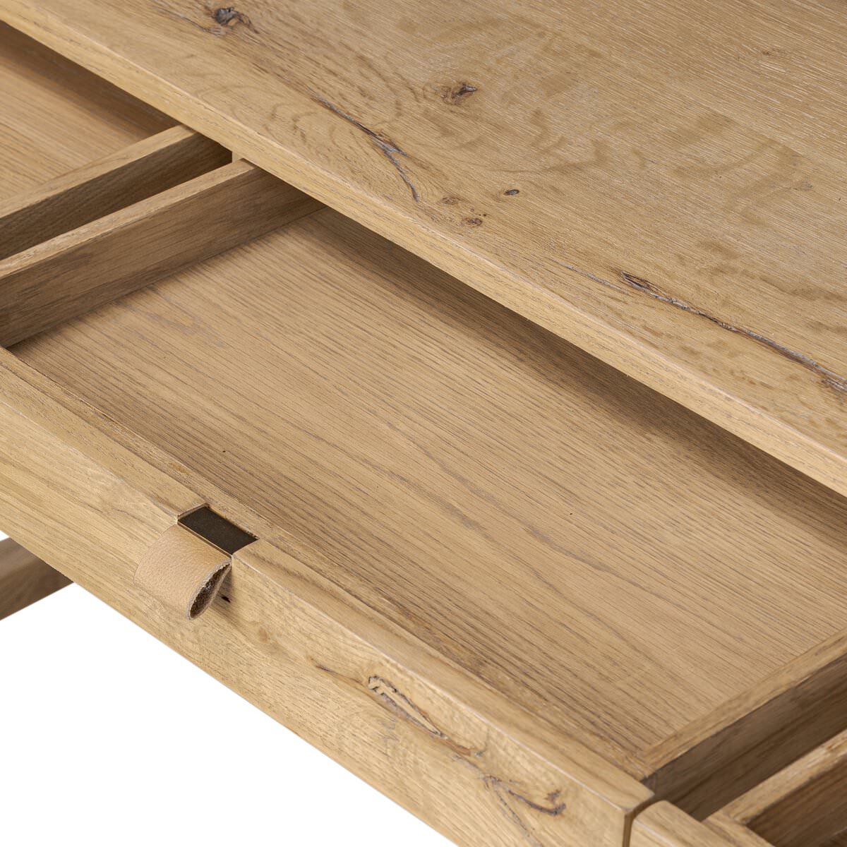 Close up of Four Hands Tula Writing Desk in Worn Oak Veneer on a white background at Addison West