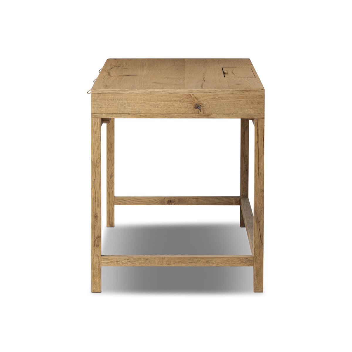 Side of Four Hands Tula Writing Desk in Worn Oak Veneer on a white background at Addison West