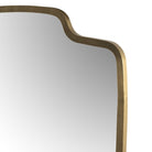Close up Four Hands Vault Mirror in Antique Brass on a white background at Addison West