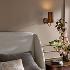 Four Hands Vincennes Sconce in Iridescent Acid Wash in a bedroom at Addison West