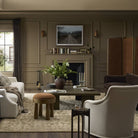 Four Hands Vincennes Sconce in Iridescent Acid Wash in a living room at Addison West