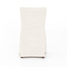 Back of Four Hands Vista Slipcovered Dining Chair in Savile Flax on a white background