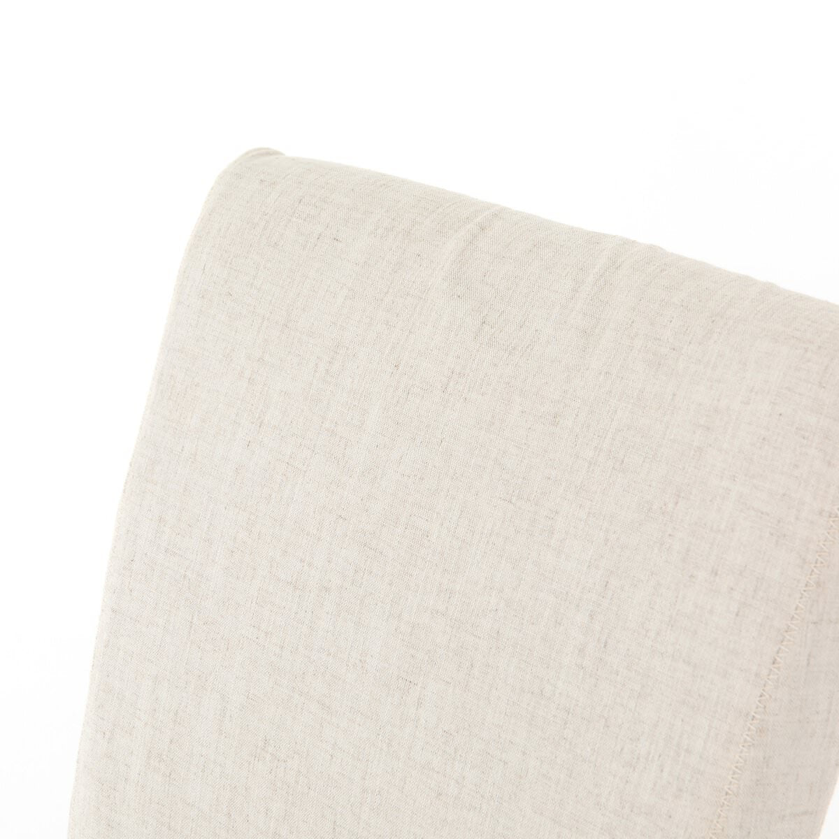Close up of Four Hands Vista Slipcovered Dining Chair in Savile Flax on a white background