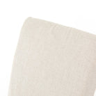 Close up of Four Hands Vista Slipcovered Dining Chair in Savile Flax on a white background