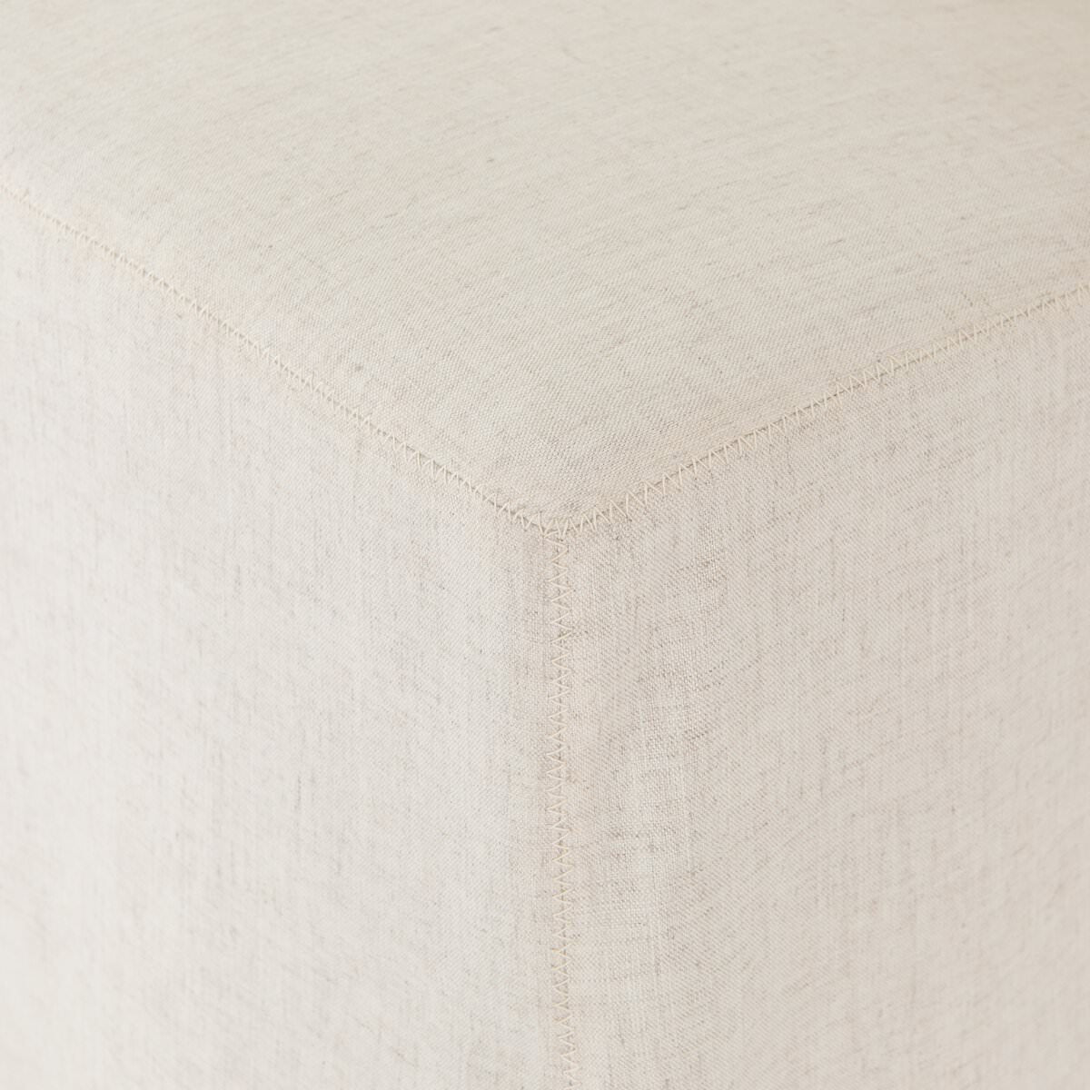 Close up of Four Hands Vista Slipcovered Dining Chair in Savile Flax on a white background