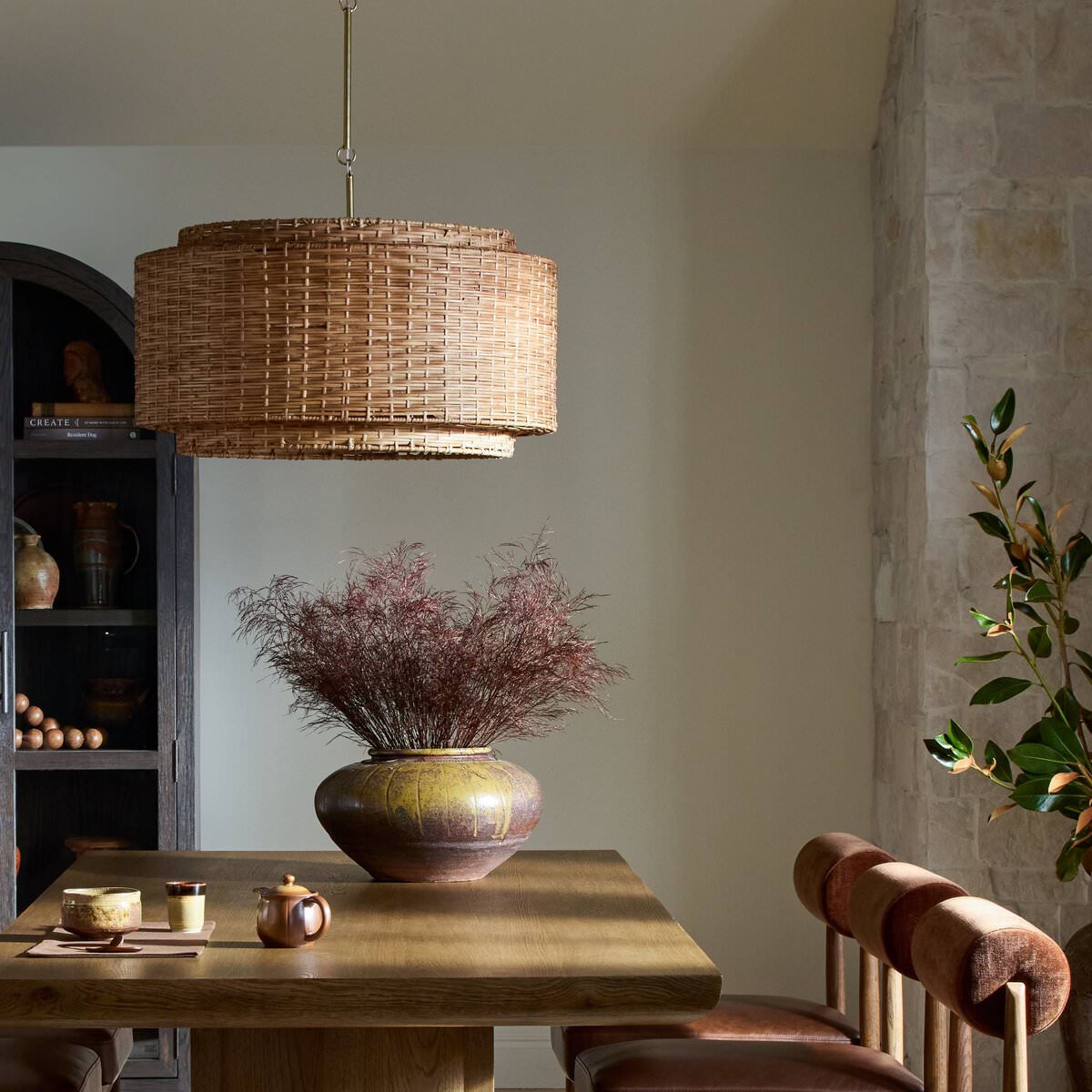 Four Hands Wendall Pendant in Antique Brass Iron in a dining room at Addison West