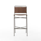 Four Hands Wharton Bar Stool in Distressed Brown on a white background at Addison West