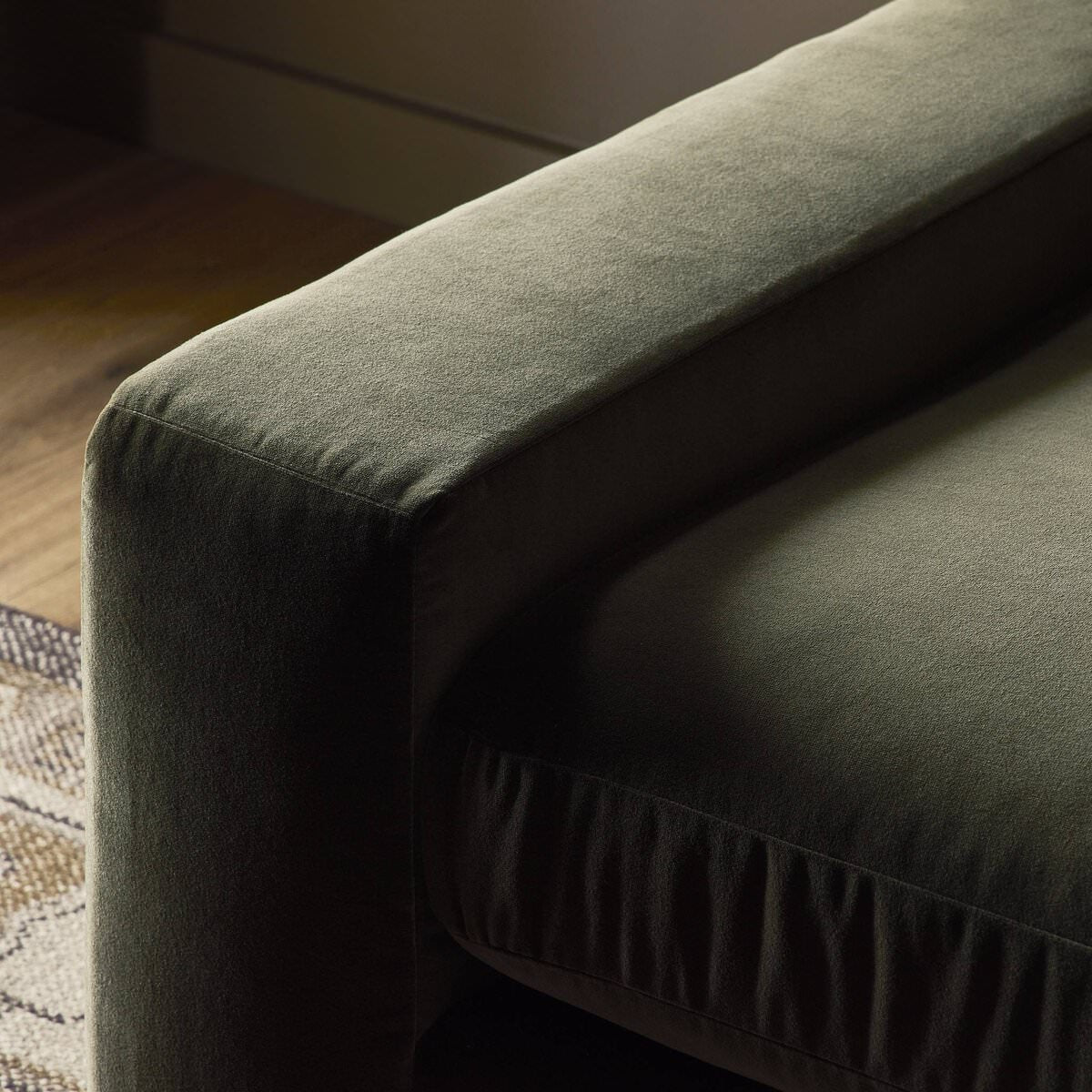 Close up of Four Hands Yelena Sofa in Surrey Olive in a living room at Addison West