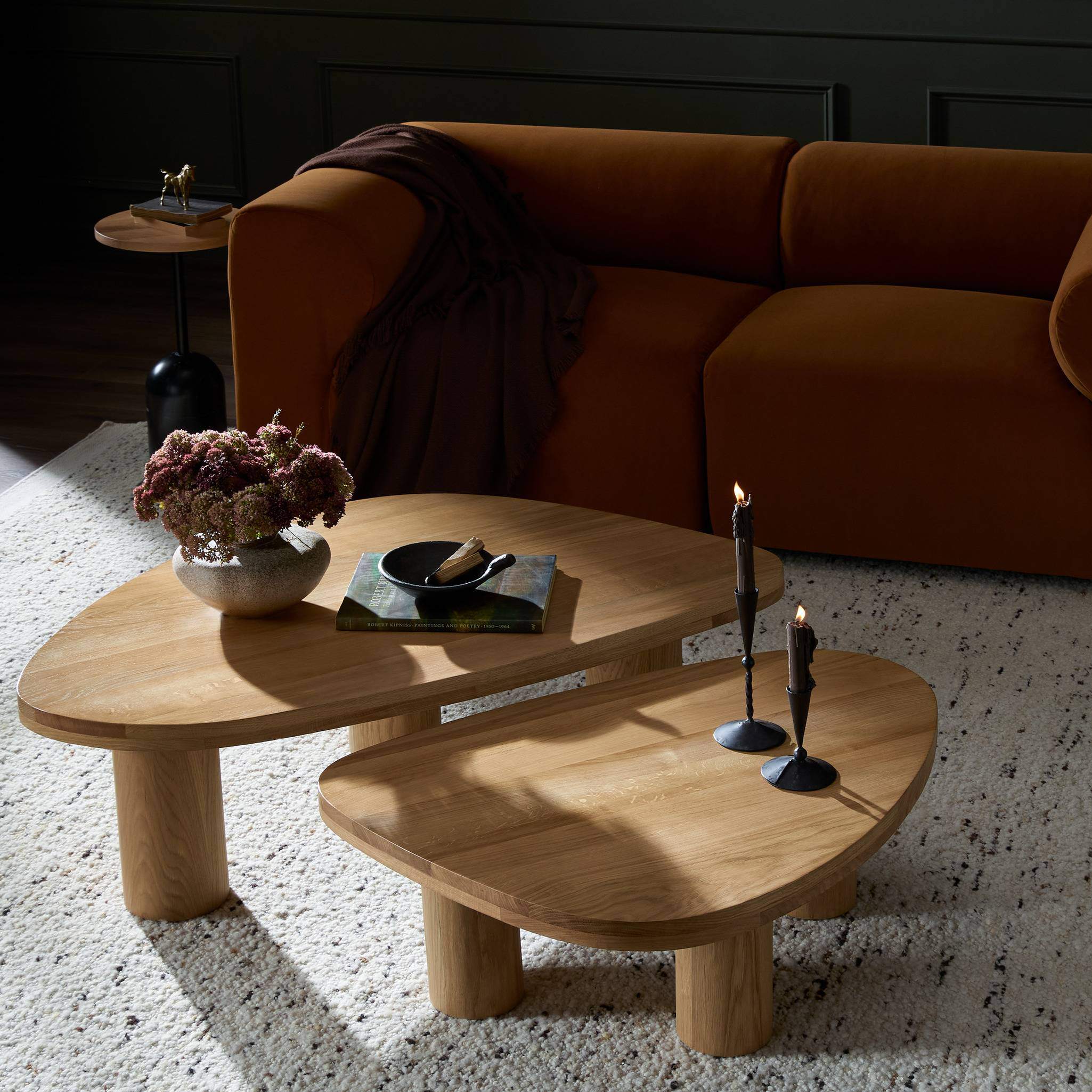 Four Hands Zion Nesting Coffee Tables in Natural Oak in living room at Addison West.