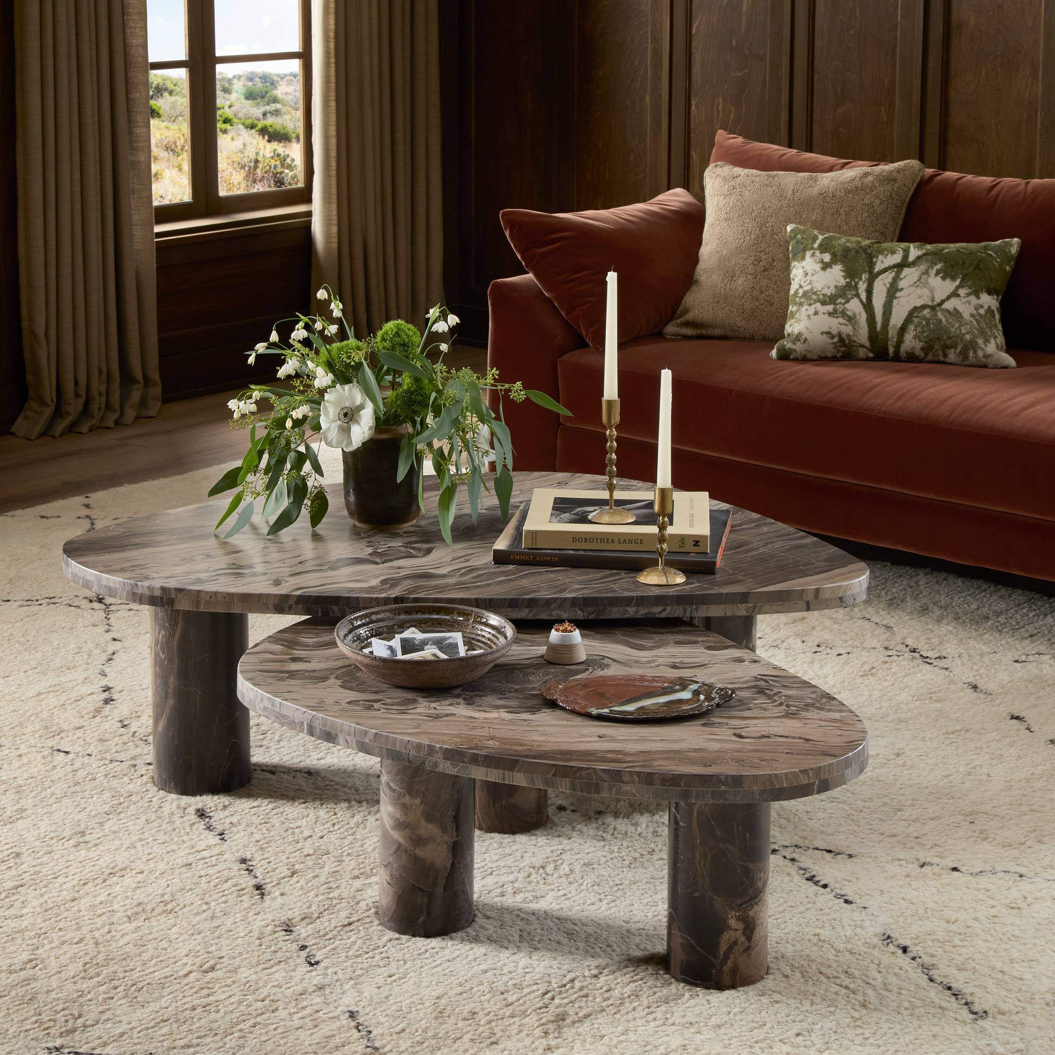 Four Hands Zion Nesting Coffee Tables in Rocky Brown Marble in living room at Addison West.