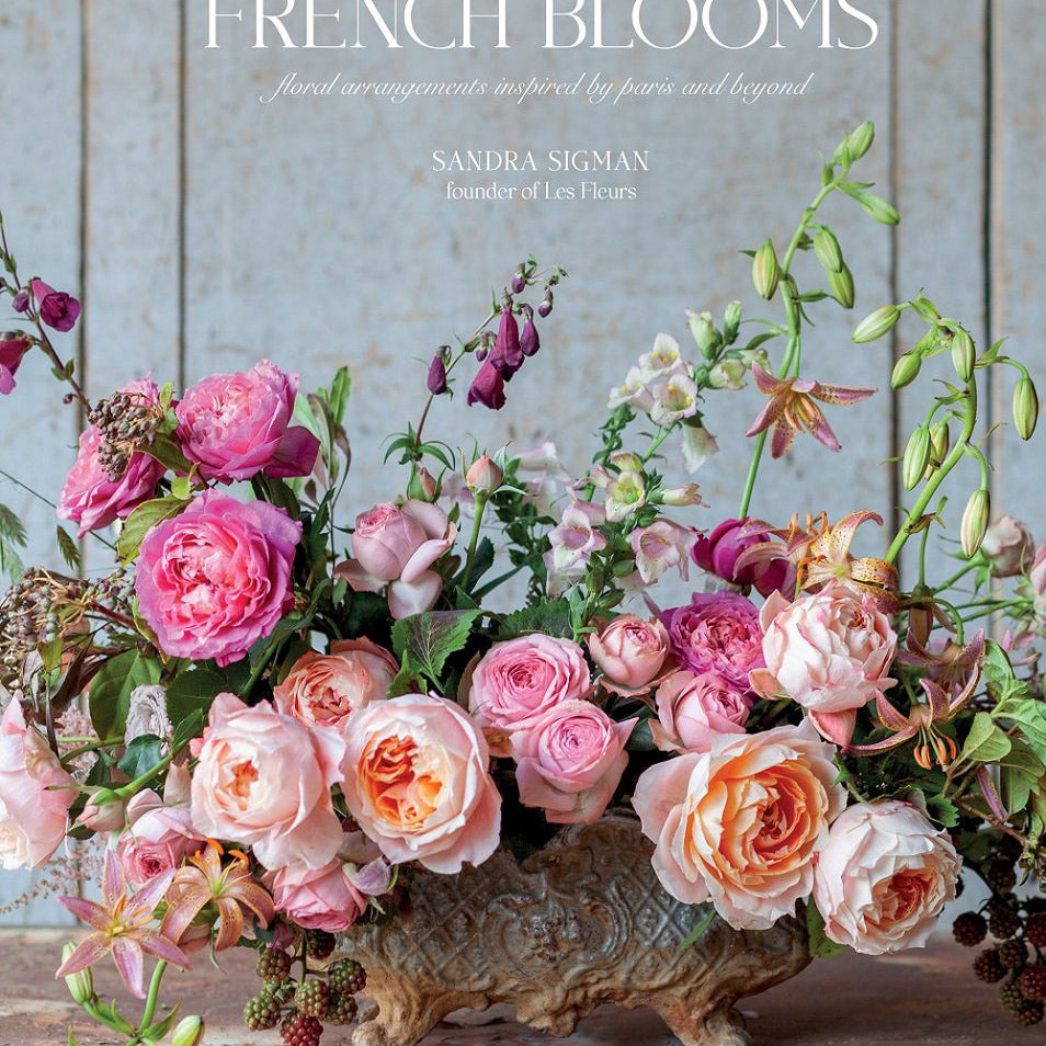 Front cover of book 'French Blooms' by Sandra Sigman with large bouquet of roses in urn on a patina surface