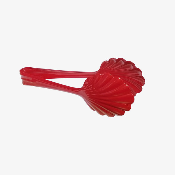 Scallop serving tongs in cherry red on a white background