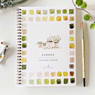 Emily Lex Garden watercolor workbook on a white table at Addison West