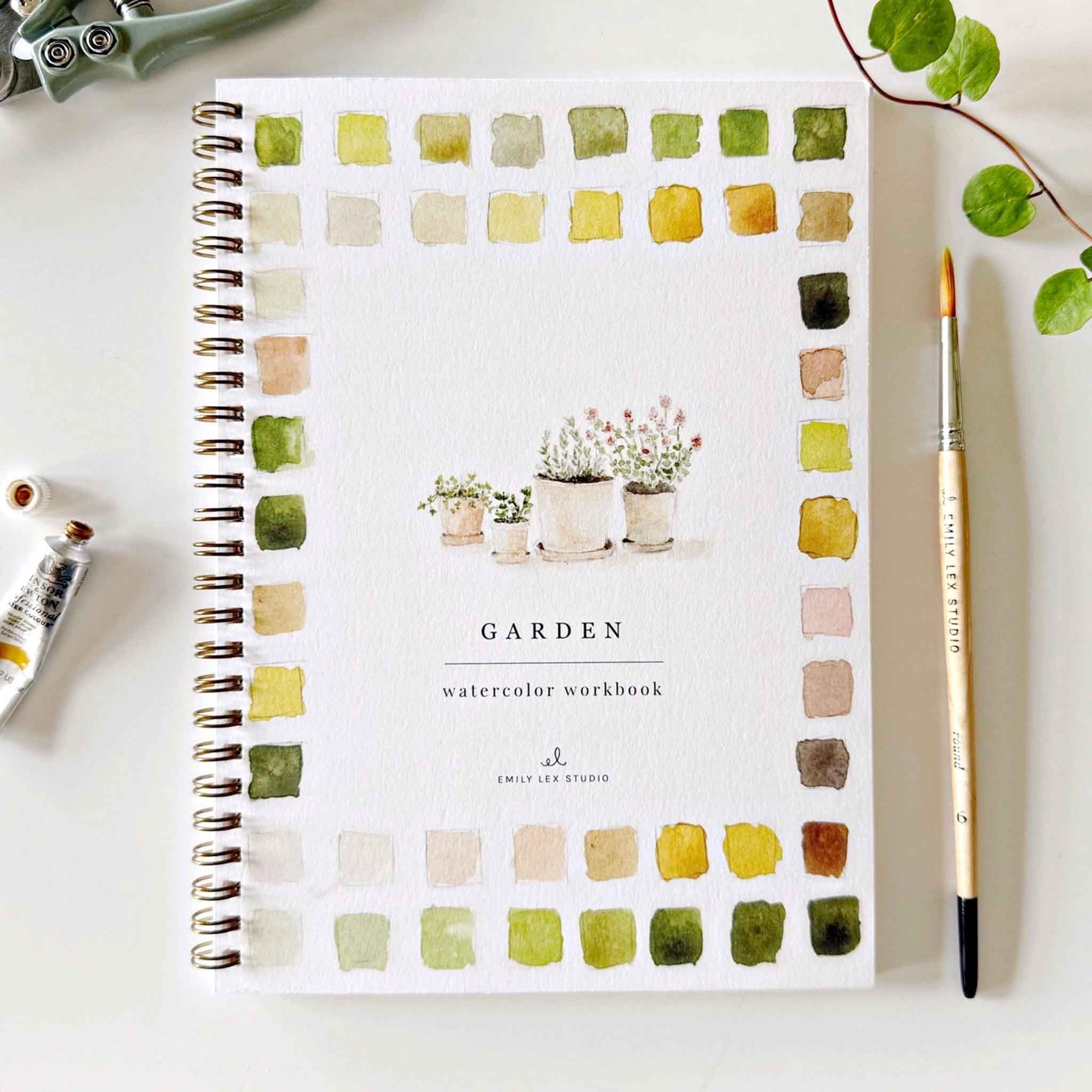 Emily Lex Garden watercolor workbook on a white table at Addison West