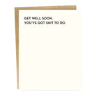 A greeting card with a simple design, white background, black text that reads 'GET WELL SOON. YOU'VE GOT SHIT TO DO.